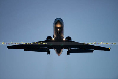 2013 - Gulfstream corporate jet on short final approach after sunset aviation stock photo