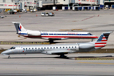 2014 - the new and old American Eagle paint schemes on ERJ-145LR N925AE and ERJ-135KL N801AE aviation aircraft stock photo #3261