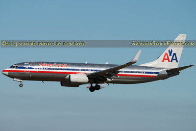 2014 - American Airlines B737-823(WL) N976AN with company aircraft behind the main gear aircraft aviation stock photo #3300