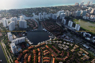 2011 - condo filled Aventura in the foreground and estate homes Golden Beach in the background aerial landscape photo #7682