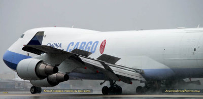 China Airlines Cargo B747-409F(SCD) B-18722 rolling out on wet runway 27 at MIA aviation cargo airline stock photo