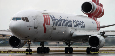 Martinair Cargo MD-11F PH-MCU taxiing out for takeoff on runway 27 aviation cargo airline stock photo