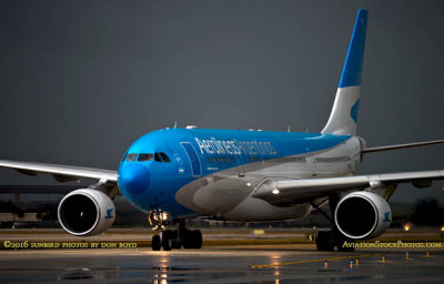 Aerolineas Argentinas Airbus A330-223 LV-FNJ taxiing in after landing on runway 27 before a storm aviation airline stock phot