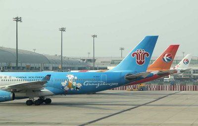Tails of 3 A-330s belonging to China Southern and China Eastern with special liveries