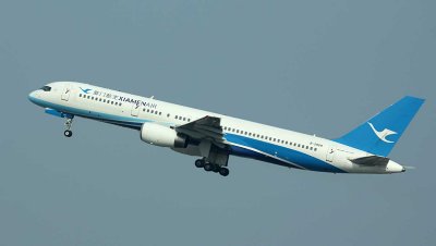 Xiamen Air's B-757 leaps into hazy Beijing sky