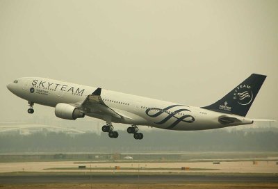 China Southern A-330 in SkyTeam livery taking into the hazy sky of PEK