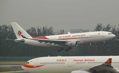Air Algerie A-330 moments from touching down in PEK while a Hainan A-330 looks on