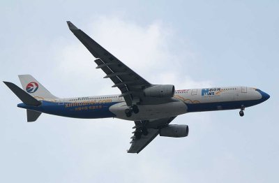 China Eastern A-330 in special livery advertizing for Xinhua News Agency