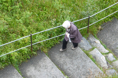 Woman trudging up 418 steps 
