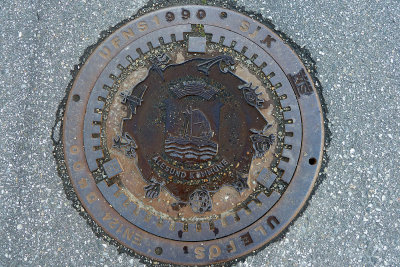 Sewer cover with city logo 