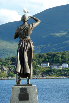 Statue of woman looking for her husband to come home from sea - near dock