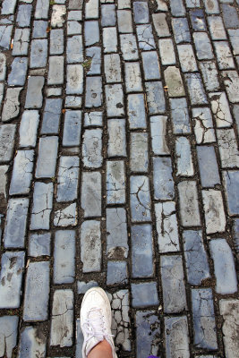 Ruth walking back to the trolley stop on Old San Juan's beautiful blue cobblestones