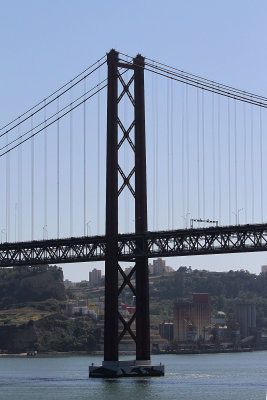 25 de Abril bridge, named after date Portugal threw off dictator Salazar in (only) 1974. Yes, its a  Golden Gate lookalike. 