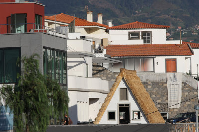 Traditional Portuguese thatched house being built (seen from Pico dos Barcelos)