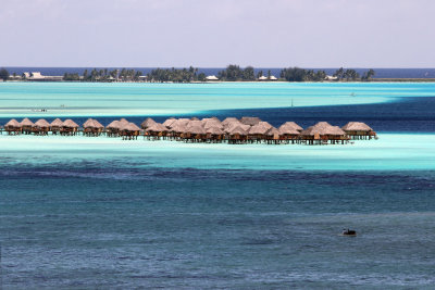 Got out of the ship's medical center (raging sinus infection) just in time to see gorgeous sail in (bungalows & colorful water)