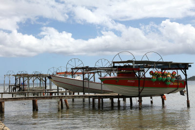 Vaitape, little south of town - boat hangers on shore