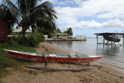 Old outrigger canoe on shore