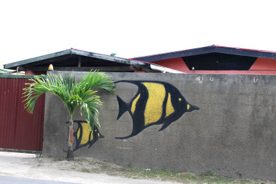Vaitape house with fish wall