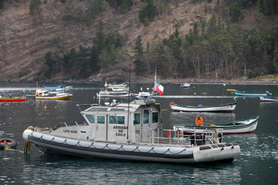 Chilean police and other boats were bobbing in the harbor.