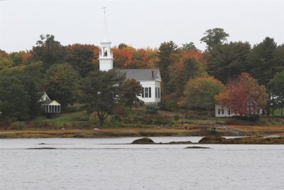 Typical NE church on shore in foggy ME 