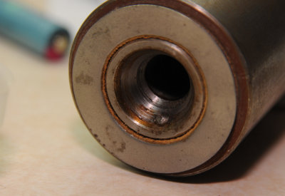 Bearing cartridge showing button to keep the spindle from rotating.