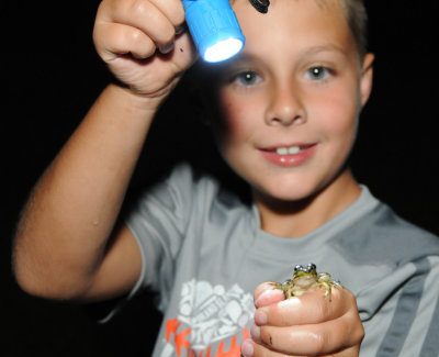 Camden with a small frog he caught