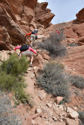 Climbing up the crack at Arches