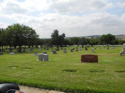 field of graves is layed out in multiple directions for a unique look