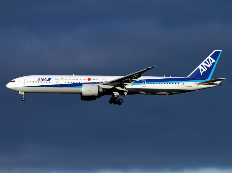 for 27R at Heathrow, nice low Sun and dark clouds in the background..