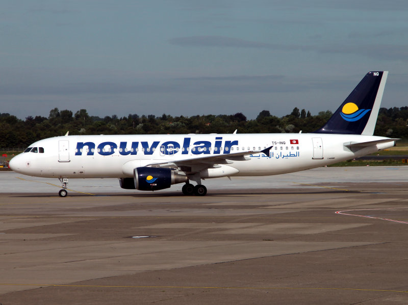 coming toward her remote stand at DUS