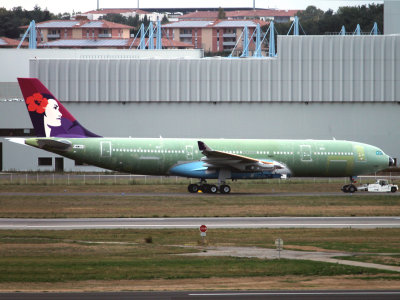 Green 'glider' at Toulouse towing to the Air France Industries plant
on the Northside for engine fitting..