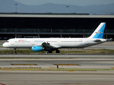 This is Metro Jet's second livery, this time with a Kolavia fin. at BCN. The second image of  this subject in this Gallery..