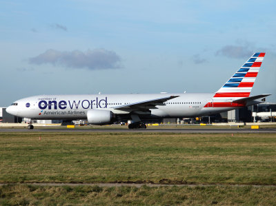 One World titles with the new livery rolling on 27L at Heathrow.