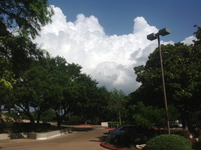 They say everything is bigger in Texas and some days the clouds sure seem to fit that description.  As I walked from my office building to the adjacent parking garage I couldn't help but notice this MASSIVE cloud formation just up over the hilltop from us.