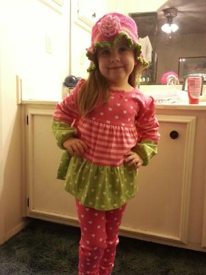 Abigail, modeling the dress outfit her Grandma bought for her and the matching hat I made for it.