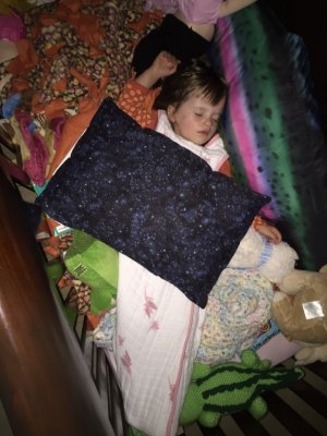 I had a co-worker that had twin girls.  Each got a blanket.  Here's a picture showing that she still sleeps (her Mom says every night) with that blanket.  In this photo, it's soft pastels, rolled up near her legs.