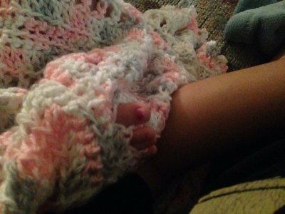 Adalynn's parents say their 5-month-old LOVES poking her fingers & toes thru the holes in her blanket, and wanted to send me a photo, showing her doing it.  :)