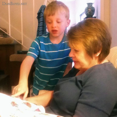 July 2012 - Kyler reading a book to grandma Karen
