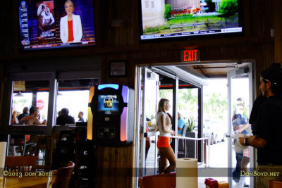 2013 - the main entrance and one of the gracious Hooters Hialeah ladies at the new Hooters Hialeah on Palm Springs Mile