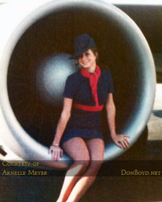 ONA stewardess Arnelle J. Pappas sitting in an engine of Overseas National Airways DC8-63 N866F Sovereign