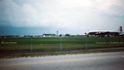 Mid to late 1950's - an Eastern Air Lines DC-7B preparing to takeoff on runway 27L at Miami International Airport