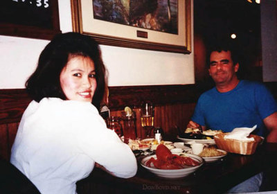 Frank E. Sullivan Jr. dining with an unknown lady