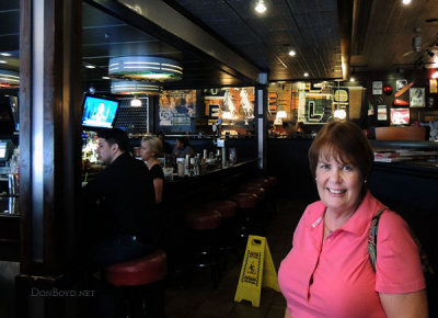 July 2014 - Karen at the spot inside Fridays at The Falls where we met 33 years before on July 3, 1981