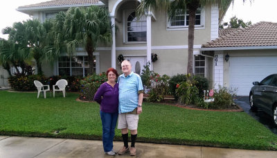 December 2014 - Lynda and Ray Kyse in front of their home in Davie