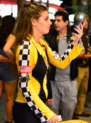 A beauty in her Halloween race car driver's costume on Lincoln Road Mall