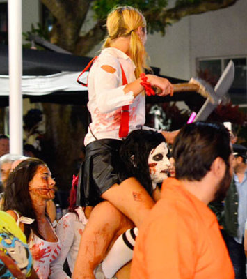 Lady pirate riding high on shoulders on Lincoln Road Mall