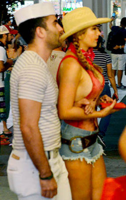 A sailor and an attractive cowgirl at Halloween on Lincoln Road Mall