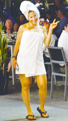 An attractive lady in her bath towel costume at Halloween on Lincoln Road Mall