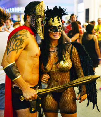 A gent and his lady in gladiator costumes at Halloween on Lincoln Road Mall
