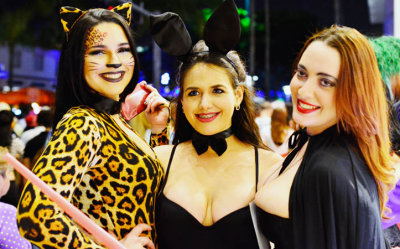Three attractive ladies at the former Lincoln Theatre on Halloween at Lincoln Road Mall